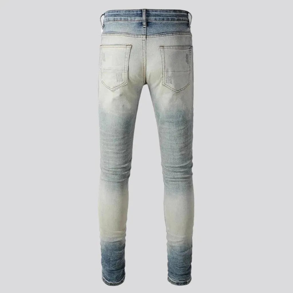 Aged men's whiskered jeans