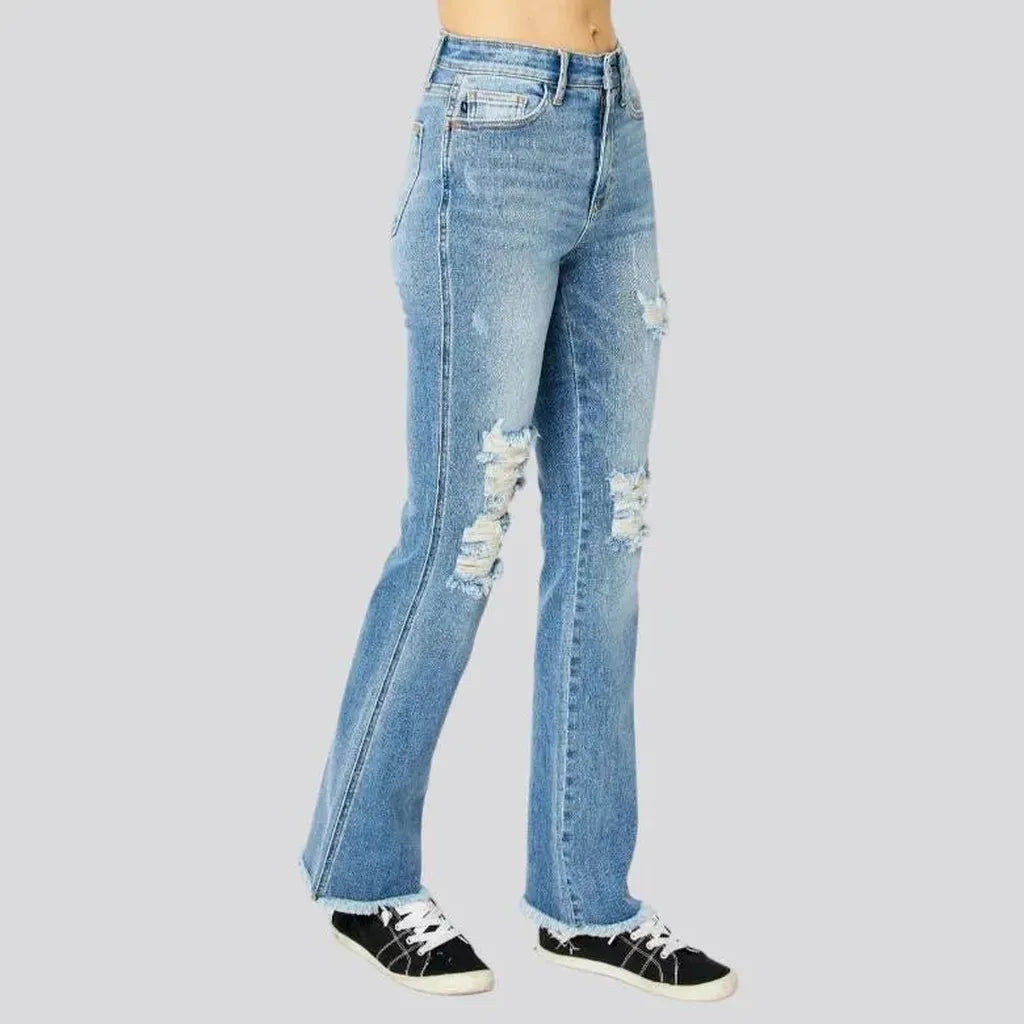 Whiskered women's distressed jeans