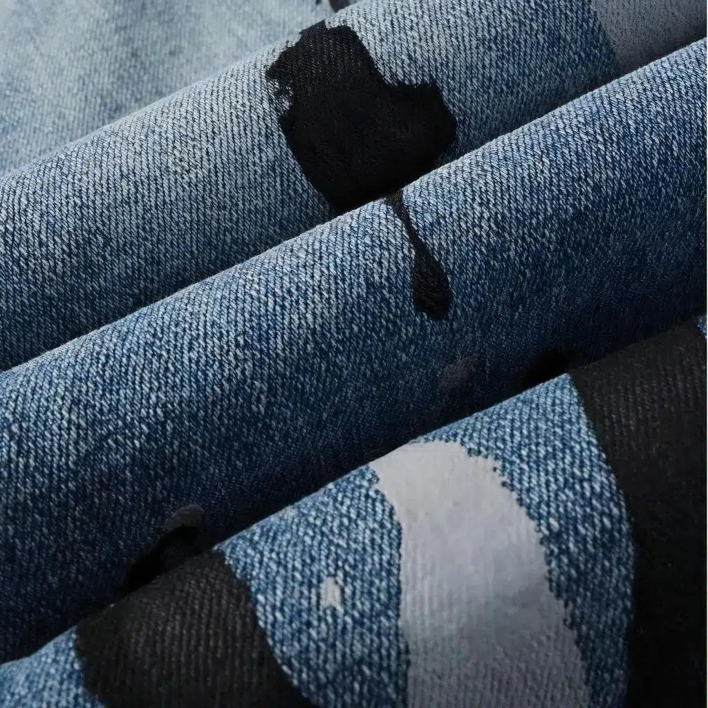 Painted men's light-wash jeans