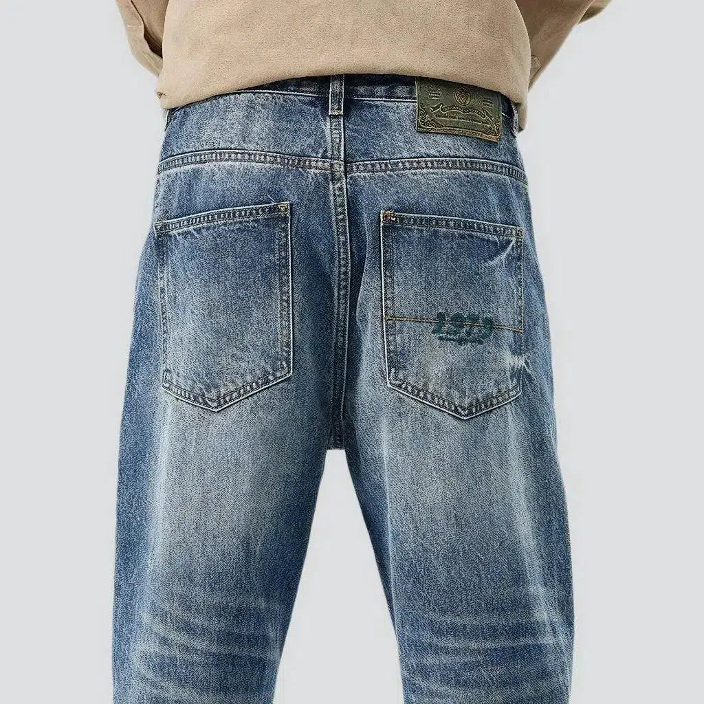 Medium-wash men's fashion jeans