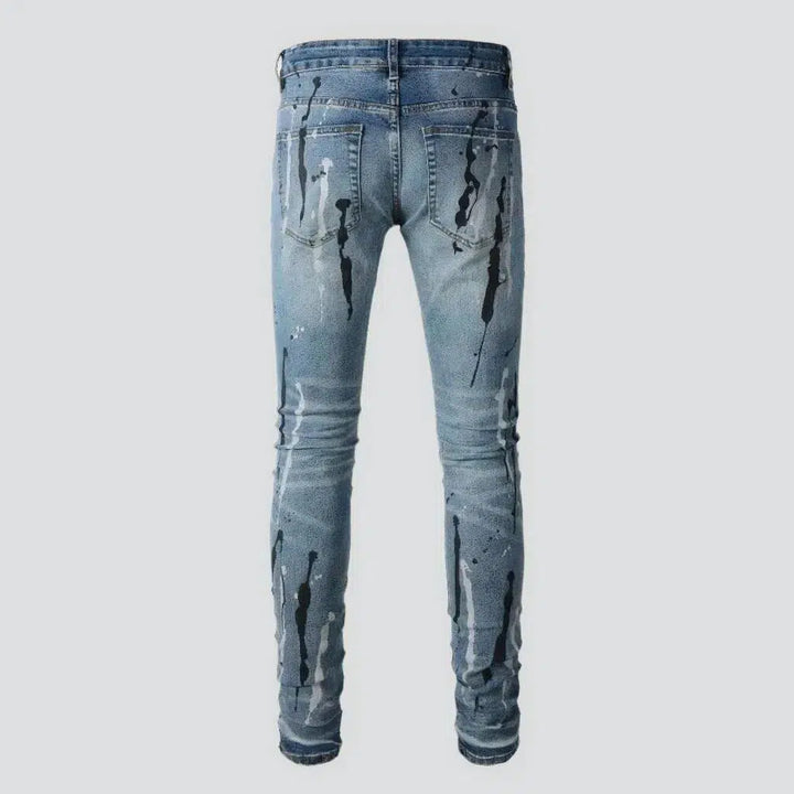 Painted men's light-wash jeans