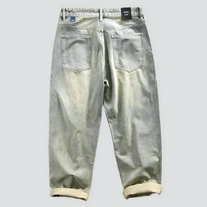 Yellow-cast men's sanded jeans