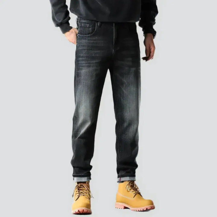 Whiskered men's tapered jeans