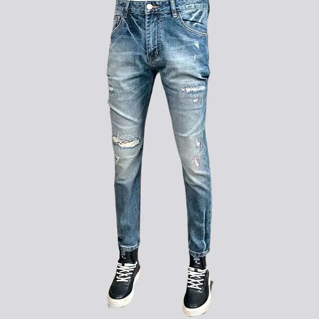 Light wash men's grunge jeans