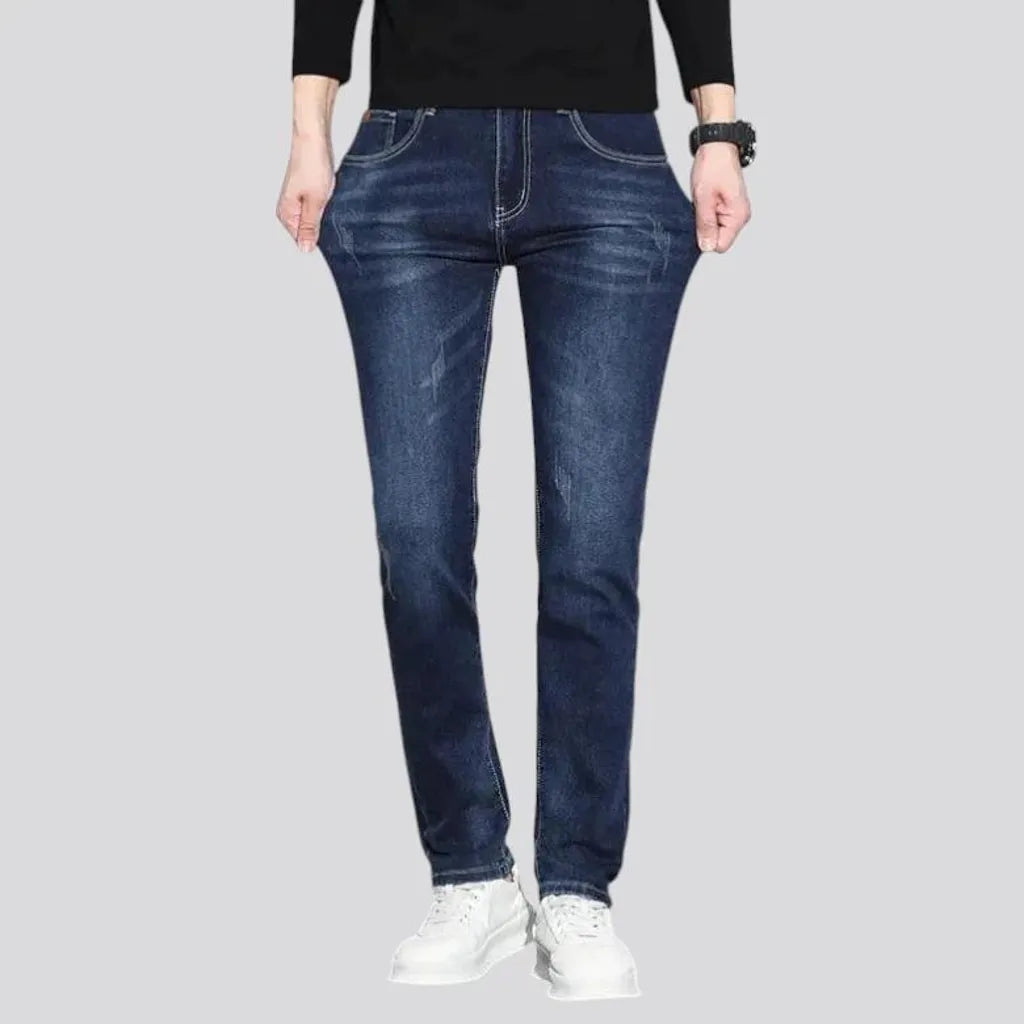 Dark slim-fitting casual men's jeans