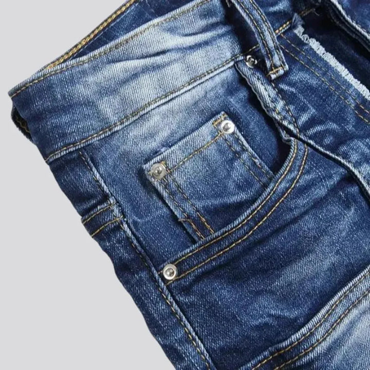 Damaged men's mid-waisted jeans