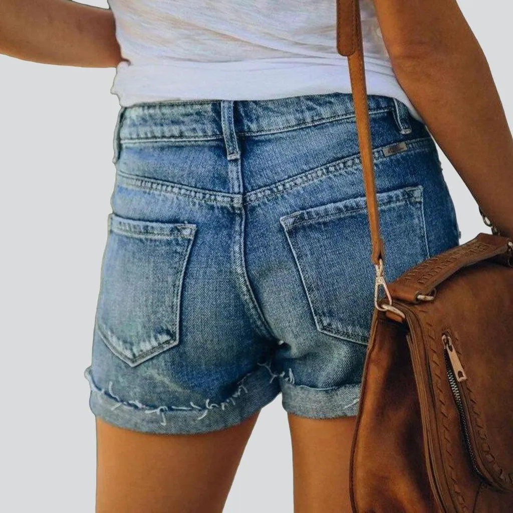 Distressed jeans shorts with buttons