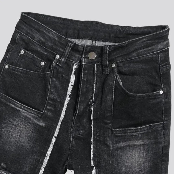 Damaged men's mid-waisted jeans