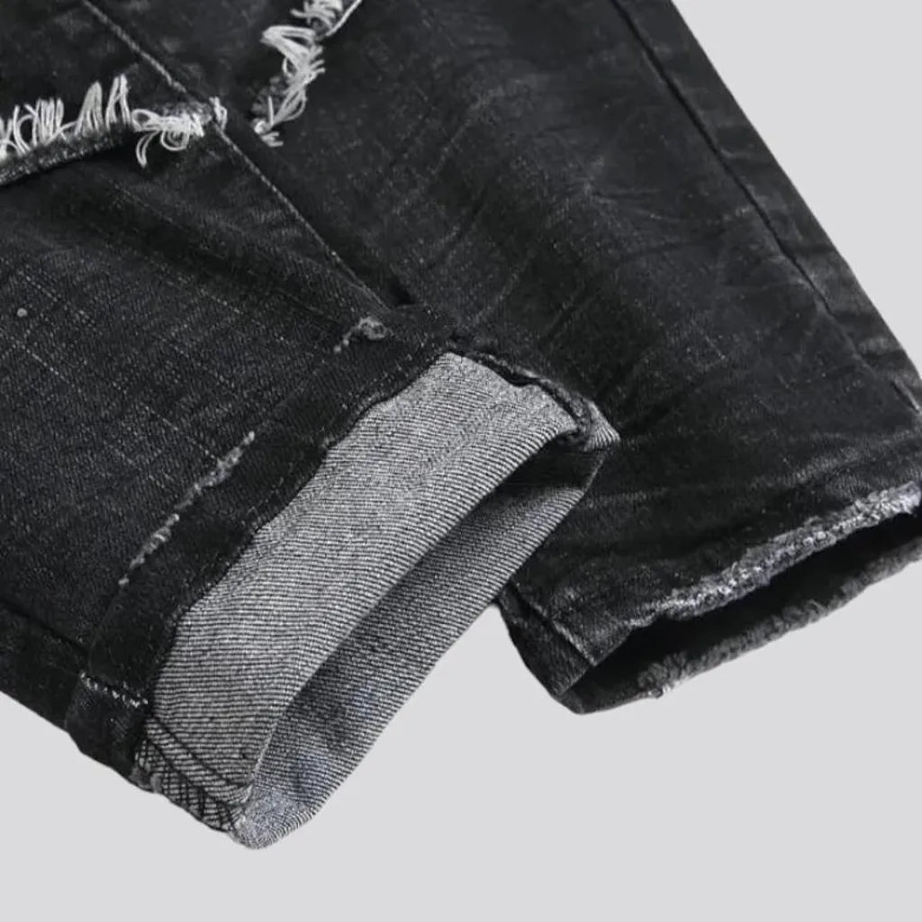 Damaged men's mid-waisted jeans