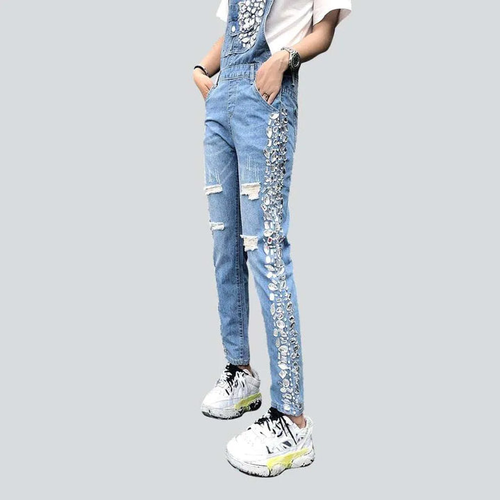 Ripped women's denim dungaree