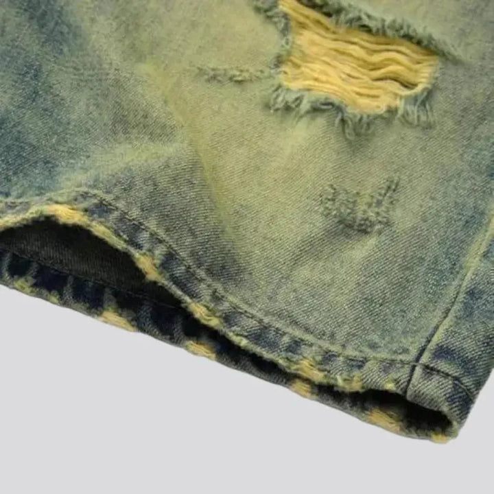 Yellow-cast distressed denim shorts for men