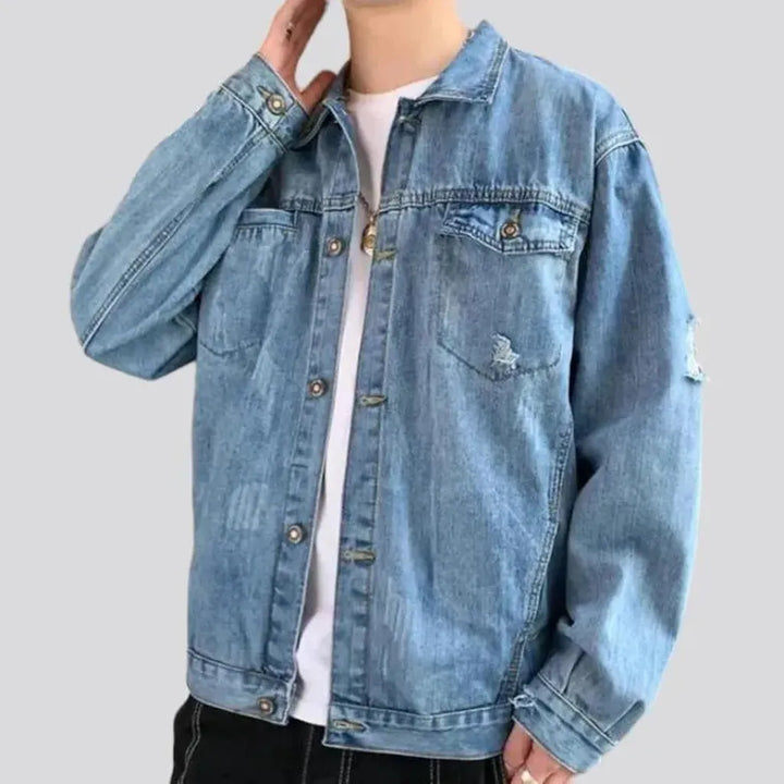 Light-wash distressed jeans jacket