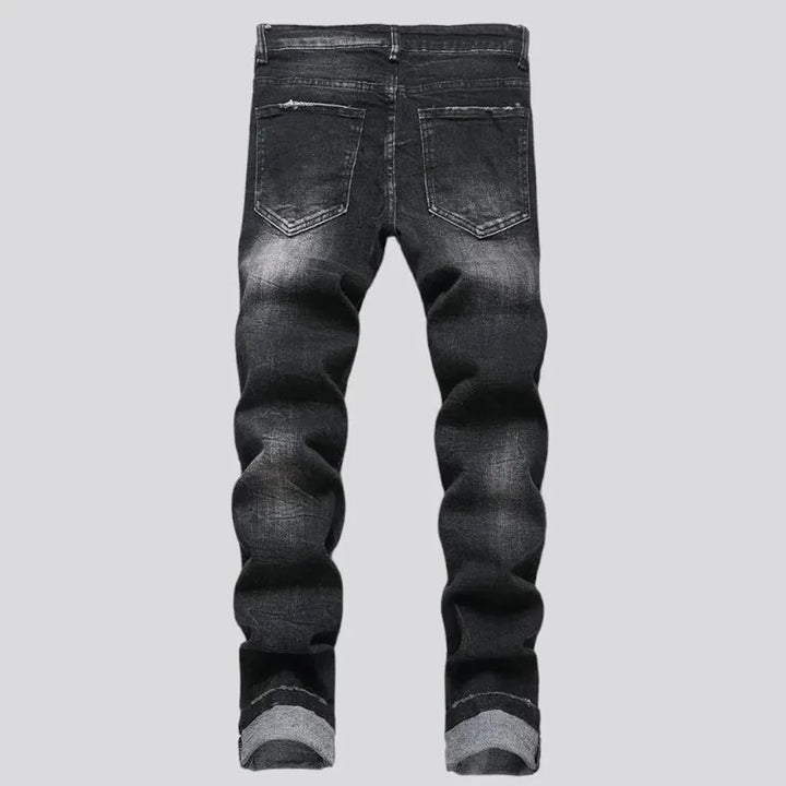 Damaged men's mid-waisted jeans