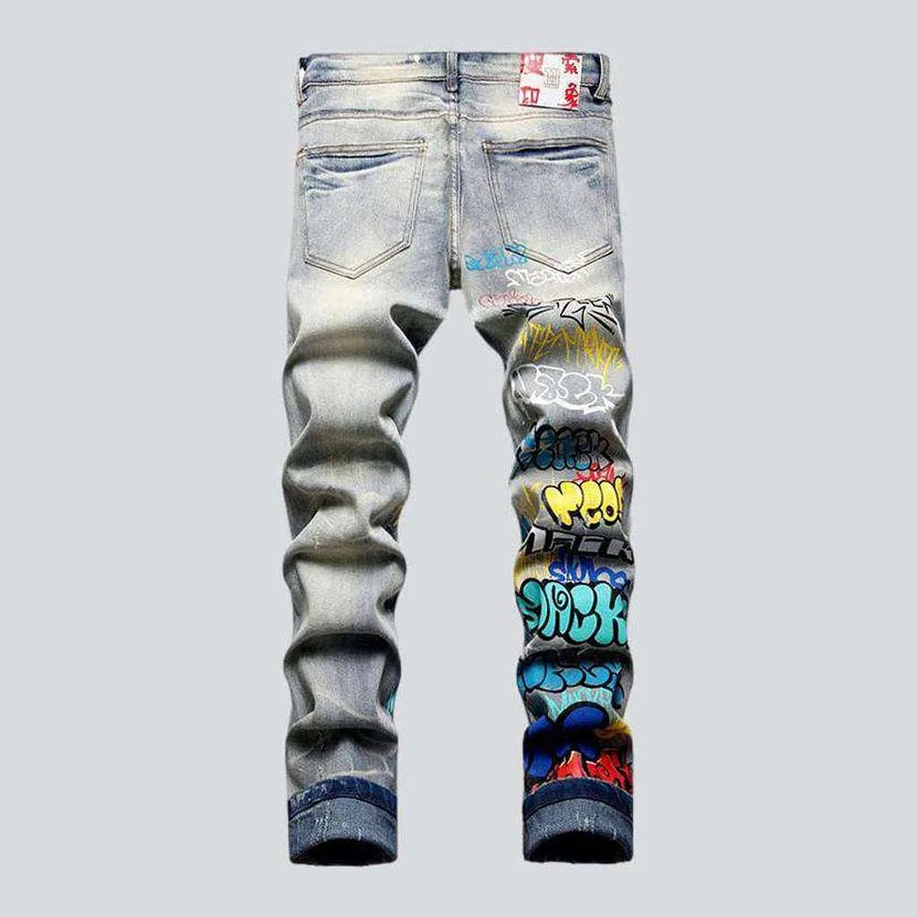 Graffiti print ripped men's jeans