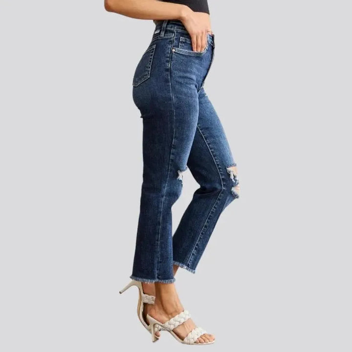 Frayed women's high-waist jeans