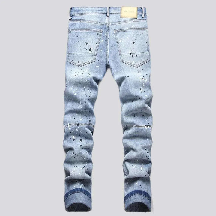 Paint-splattered men's patchwork jeans