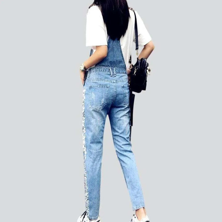 Ripped women's denim dungaree