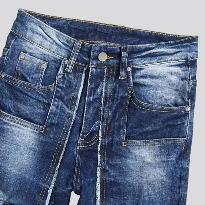 Damaged men's mid-waisted jeans