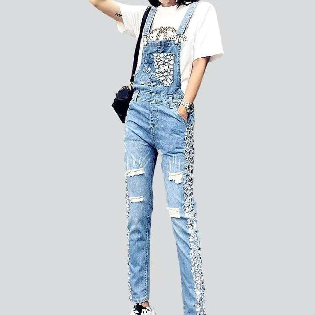 Ripped women's denim dungaree