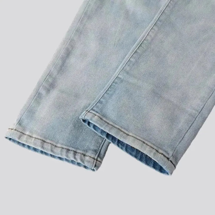 Grunge men's light-wash jeans