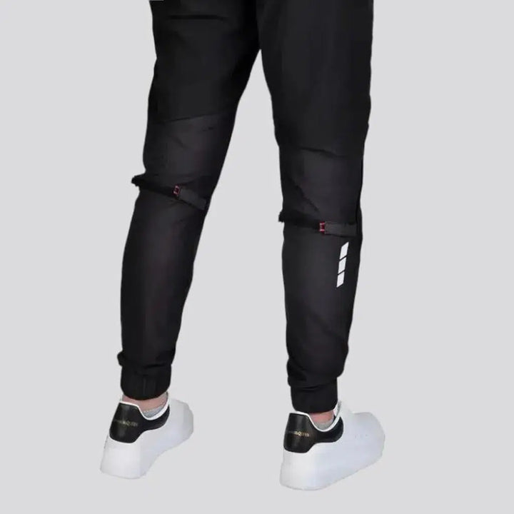 Black joggers riding denim pants