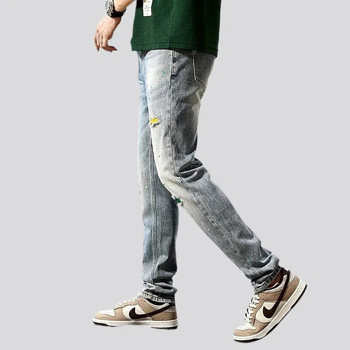 Grunge men's distressed jeans