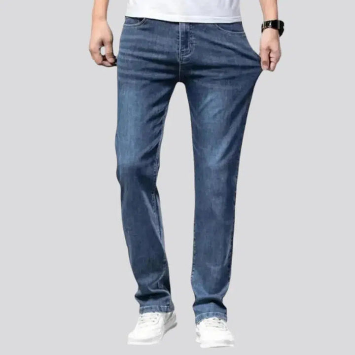 Whiskered men's mid-waist jeans