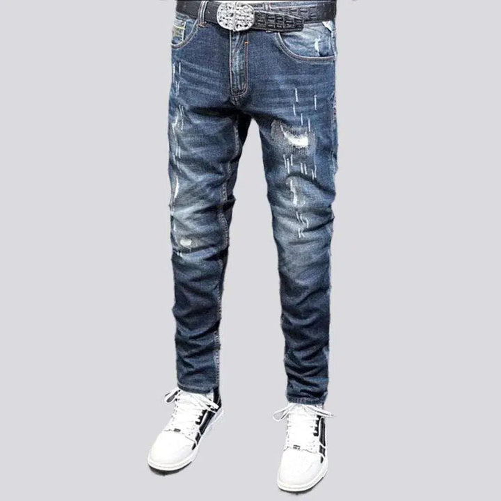 Grunge dark men's wash jeans