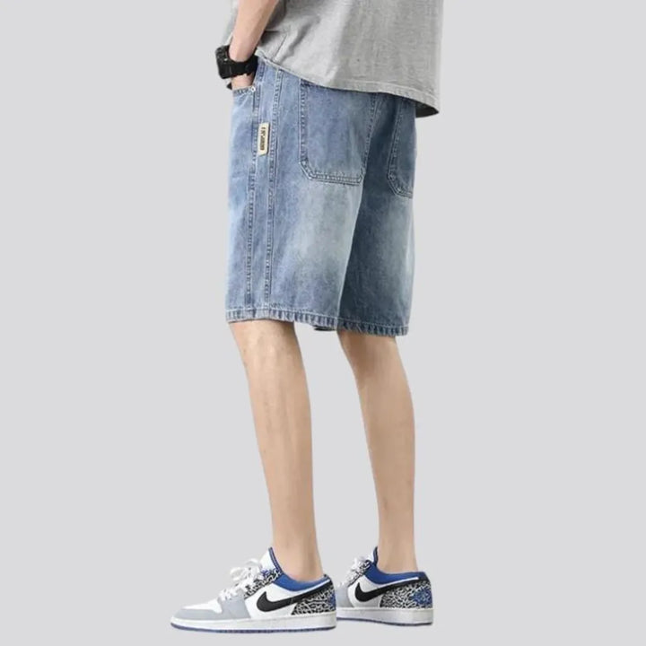 Sanded knee-length jeans shorts