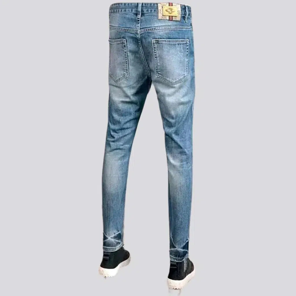 Light wash men's grunge jeans