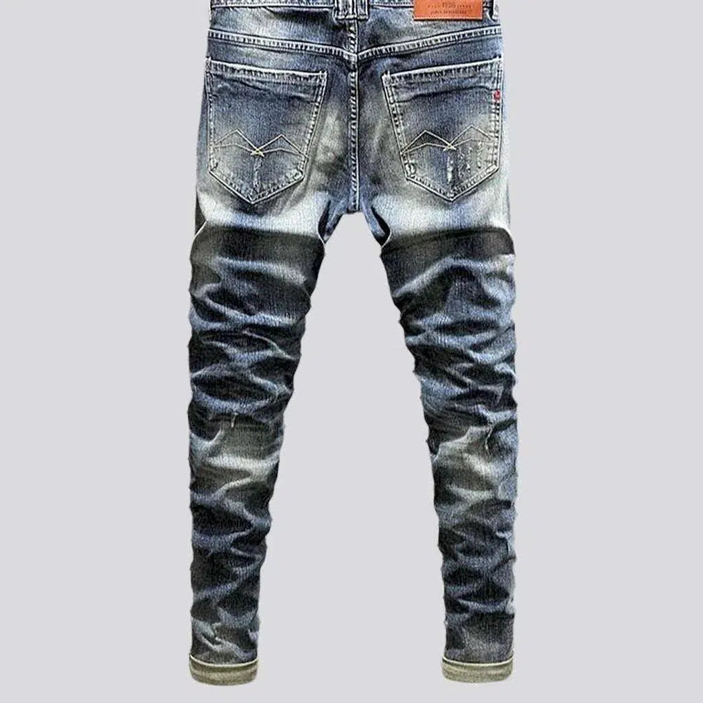 Distressed men's street jeans