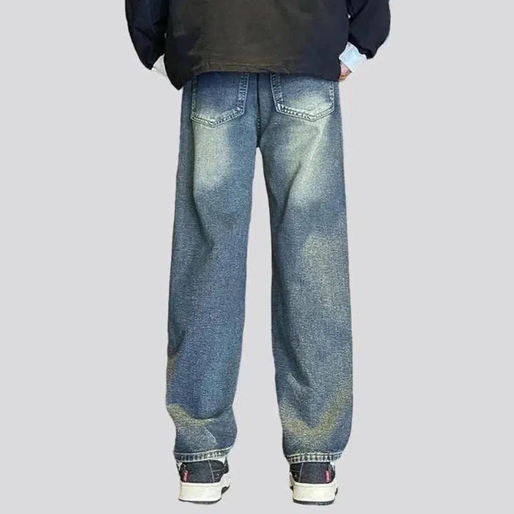 Floor-length men's stonewashed jeans