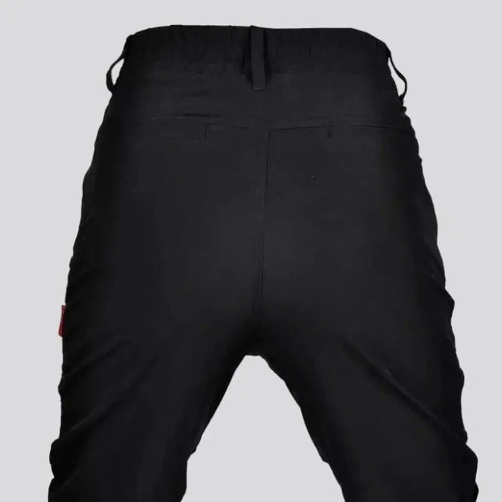 Black joggers riding denim pants