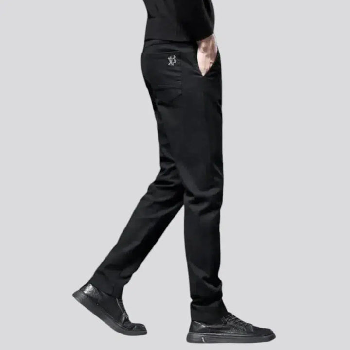 Dark men's mid-waist jeans