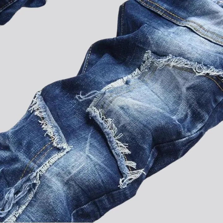 Damaged men's mid-waisted jeans