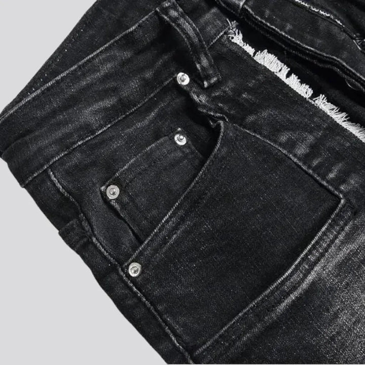 Damaged men's mid-waisted jeans