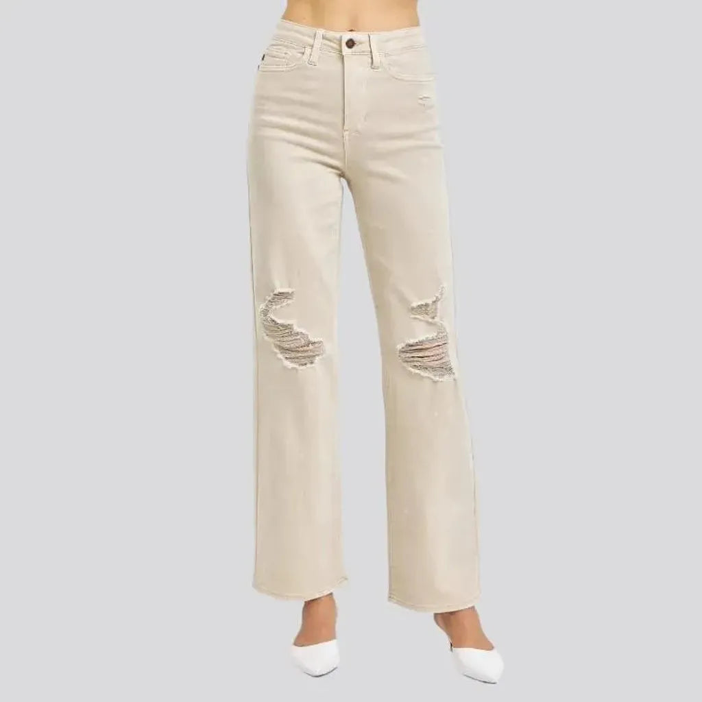 Distressed women's sand jeans