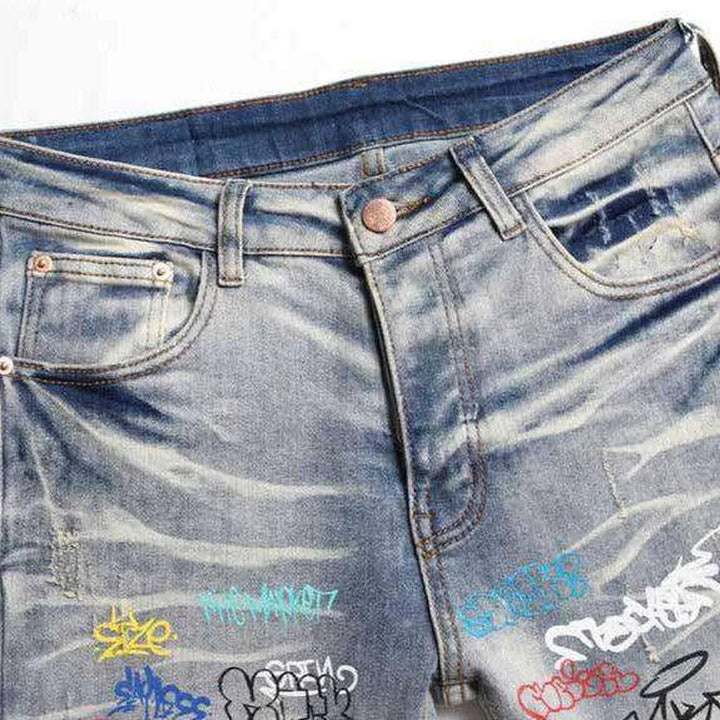 Graffiti print ripped men's jeans