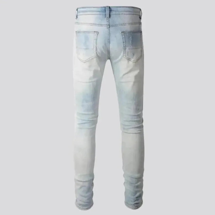 Grunge men's light-wash jeans