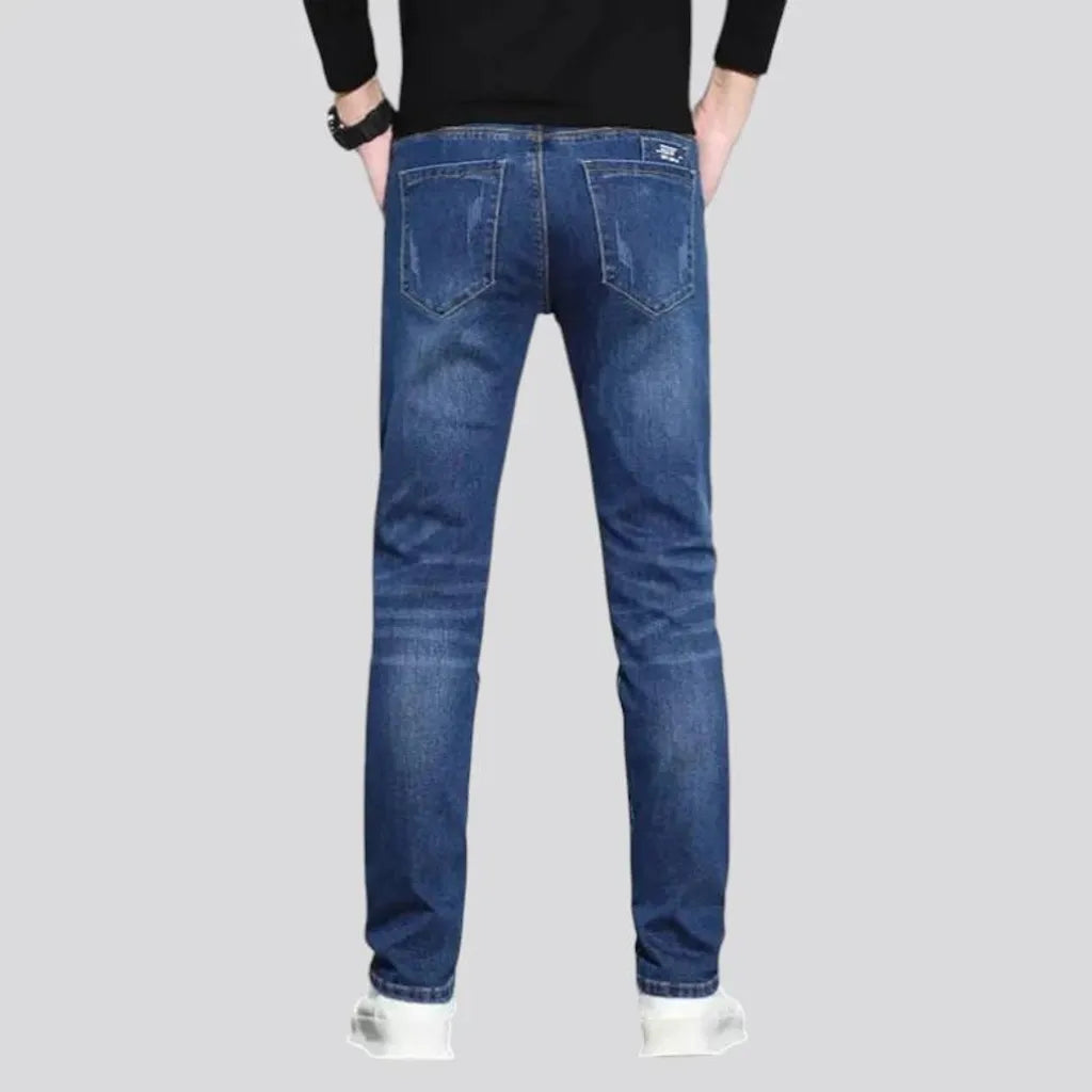 Dark abraded slim fit men's jeans