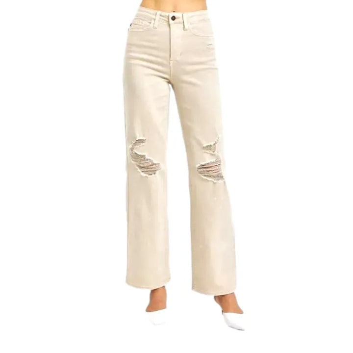 Distressed women's sand jeans