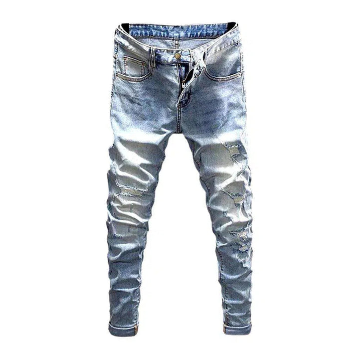 Sanded men's distressed jeans